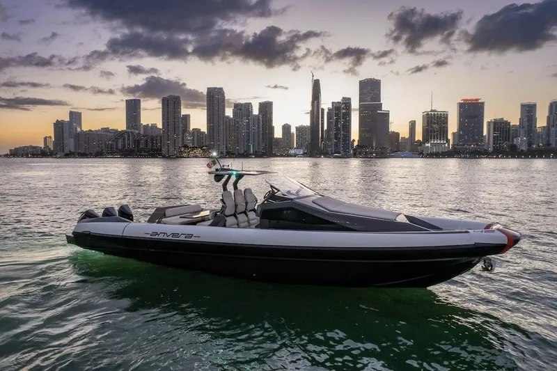 The Image of 2025 Anvera 42 Speedster boat cruising near city skyline at sunset. - 0