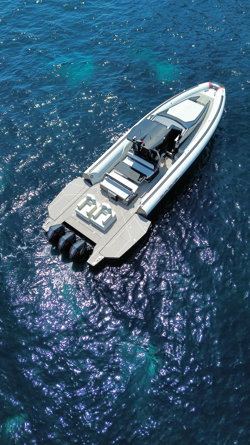 Slide: The Image of 2025 Anvera 42 Speedster boat cruising on clear blue water. - 15
