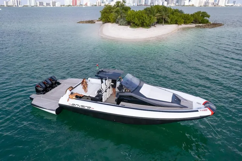 Slide: The Image of 2025 Anvera 42 Speedster boat cruising near a small island in clear waters. - 23