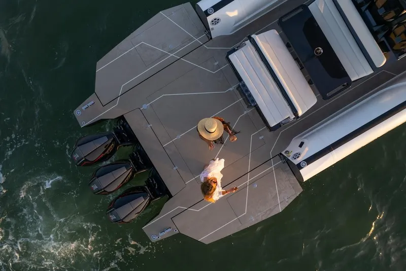 Slide: The Image of Overhead view of 2025 Anvera 42 Speedster boat with two people on deck. - 25