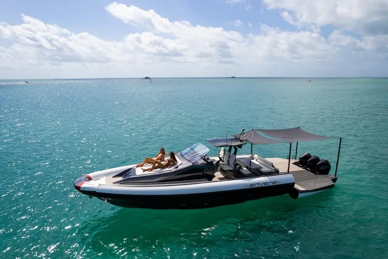 Slide: The Image of 2025 Anvera 42 Speedster yacht cruising on turquoise ocean under clear skies. - 26