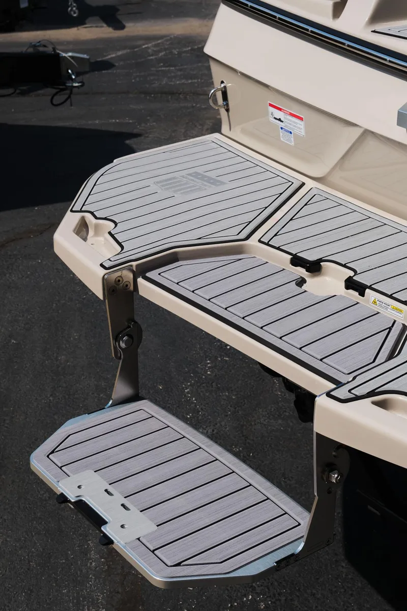 Slide: The Image of 2025 MasterCraft XT24 swim platform with foldable step, featuring sleek design and durable materials. - 10