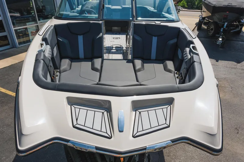 Slide: The Image of 2025 MasterCraft XT24 boat interior with sleek seating and modern design. - 14