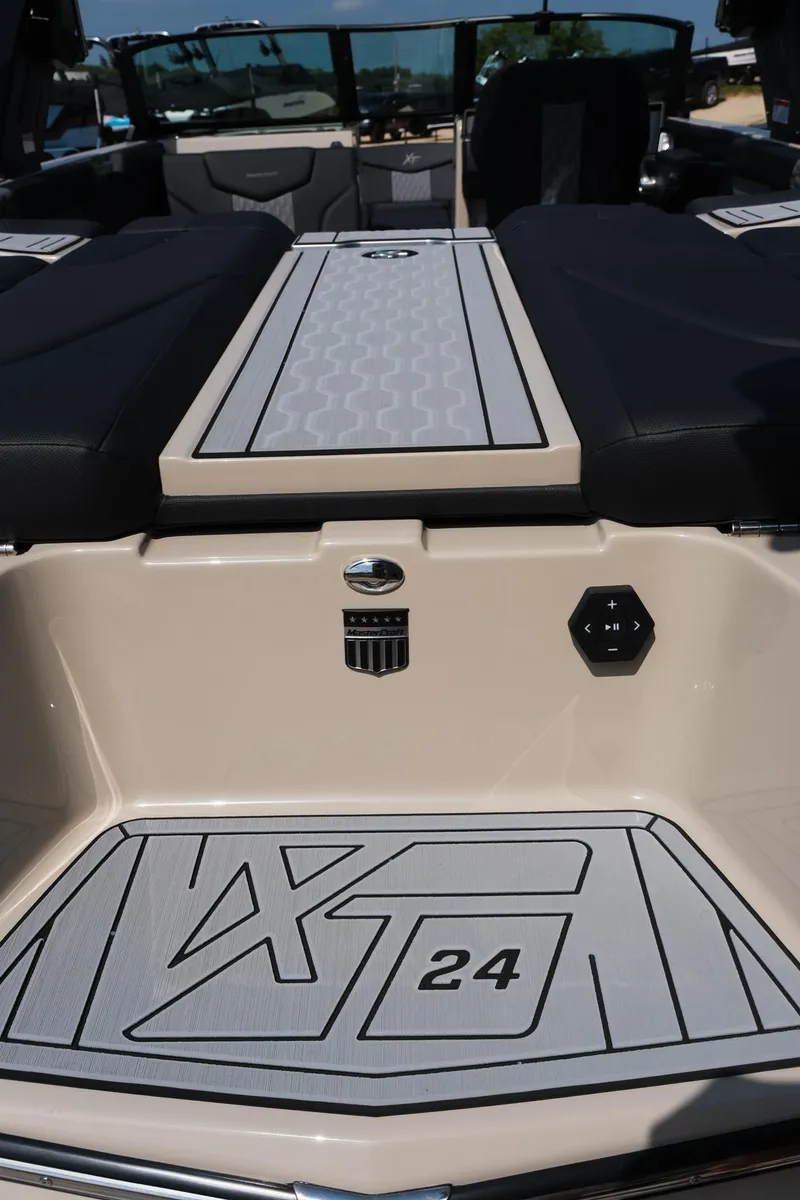 Slide: The Image of 2025 MasterCraft XT24 boat interior with sleek design and modern features. - 17