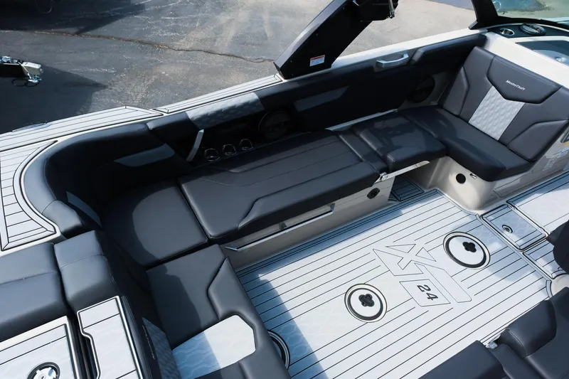 Slide: The Image of 2025 MasterCraft XT24 boat interior with sleek seating and modern design. - 20