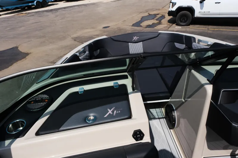 Slide: The Image of 2025 MasterCraft XT24 boat interior with sleek design and modern dashboard. - 22