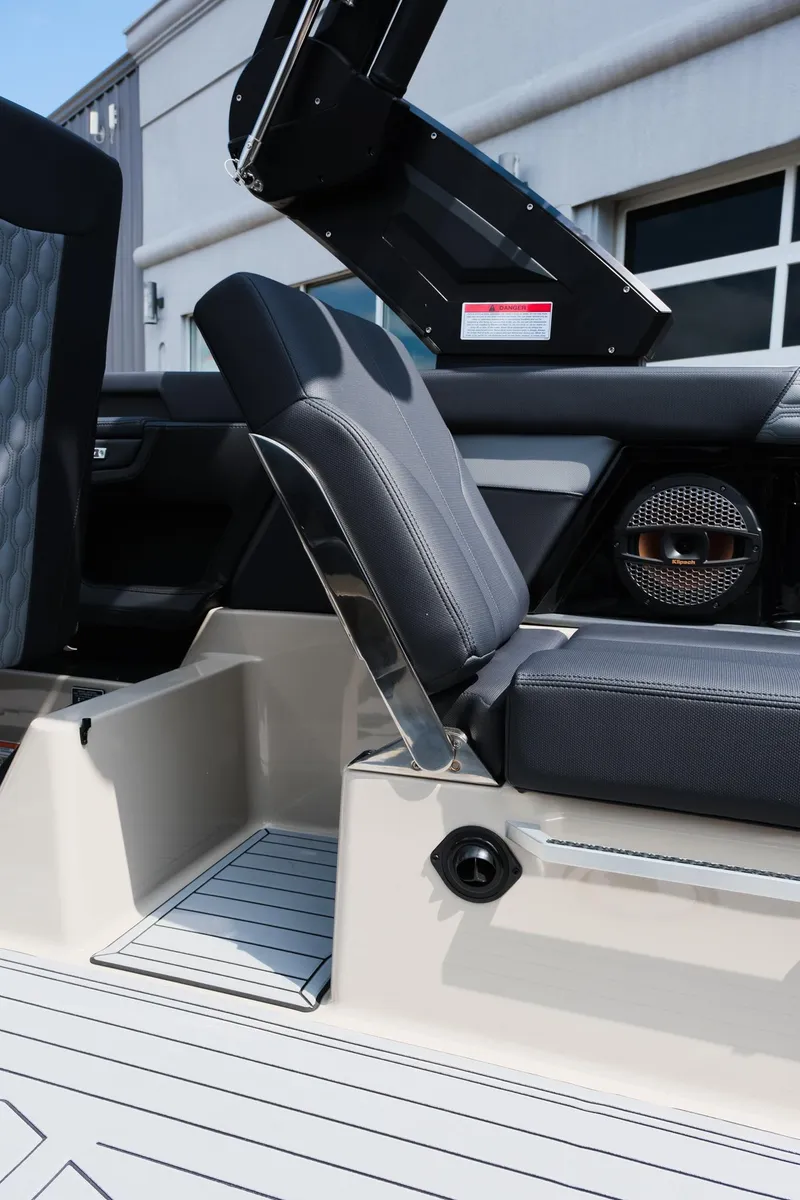 Slide: The Image of 2025 MasterCraft XT24 boat interior with adjustable seating and modern design features. - 25