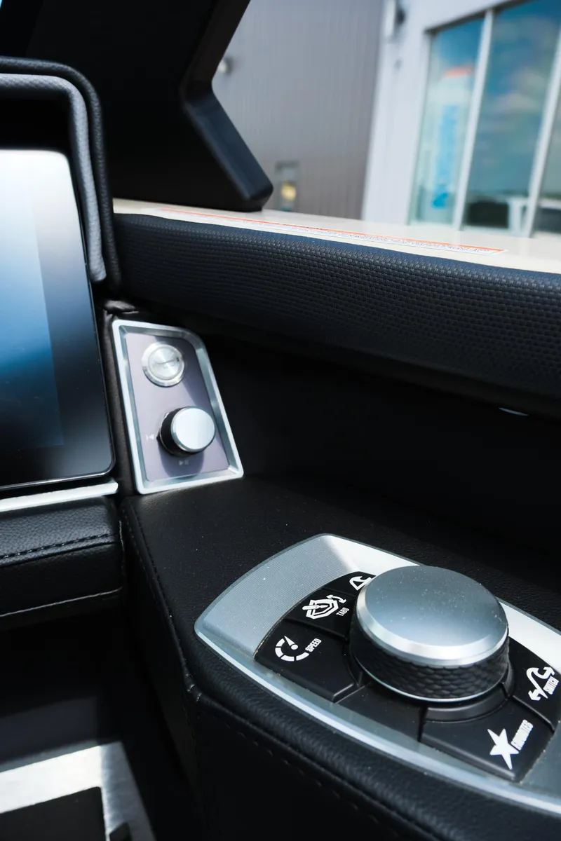 Slide: The Image of 2025 MasterCraft XT24 boat dashboard with modern control panel and sleek design. - 27