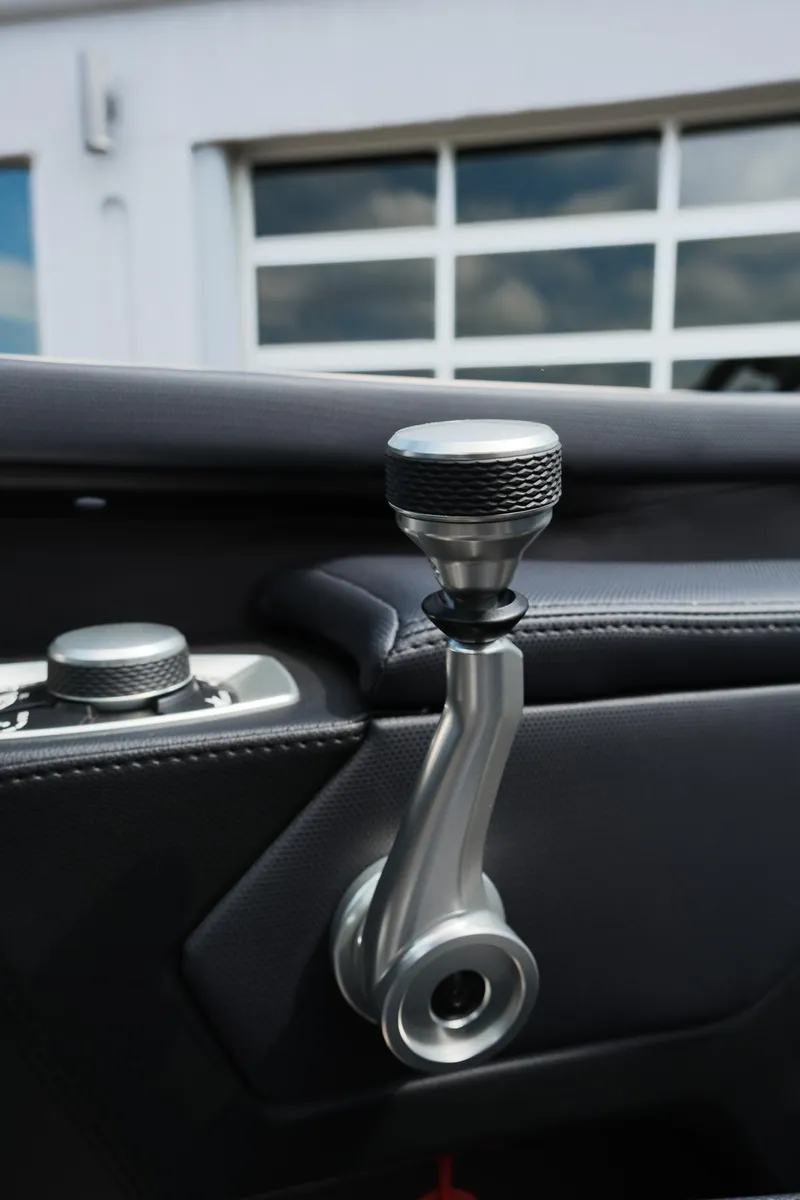 Slide: The Image of 2025 MasterCraft XT24 boat interior detail with sleek control lever. - 28