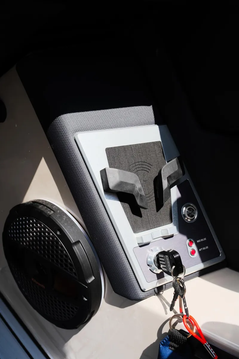 Slide: The Image of 2025 MasterCraft XT24 boat dashboard with speaker and control panel. - 29