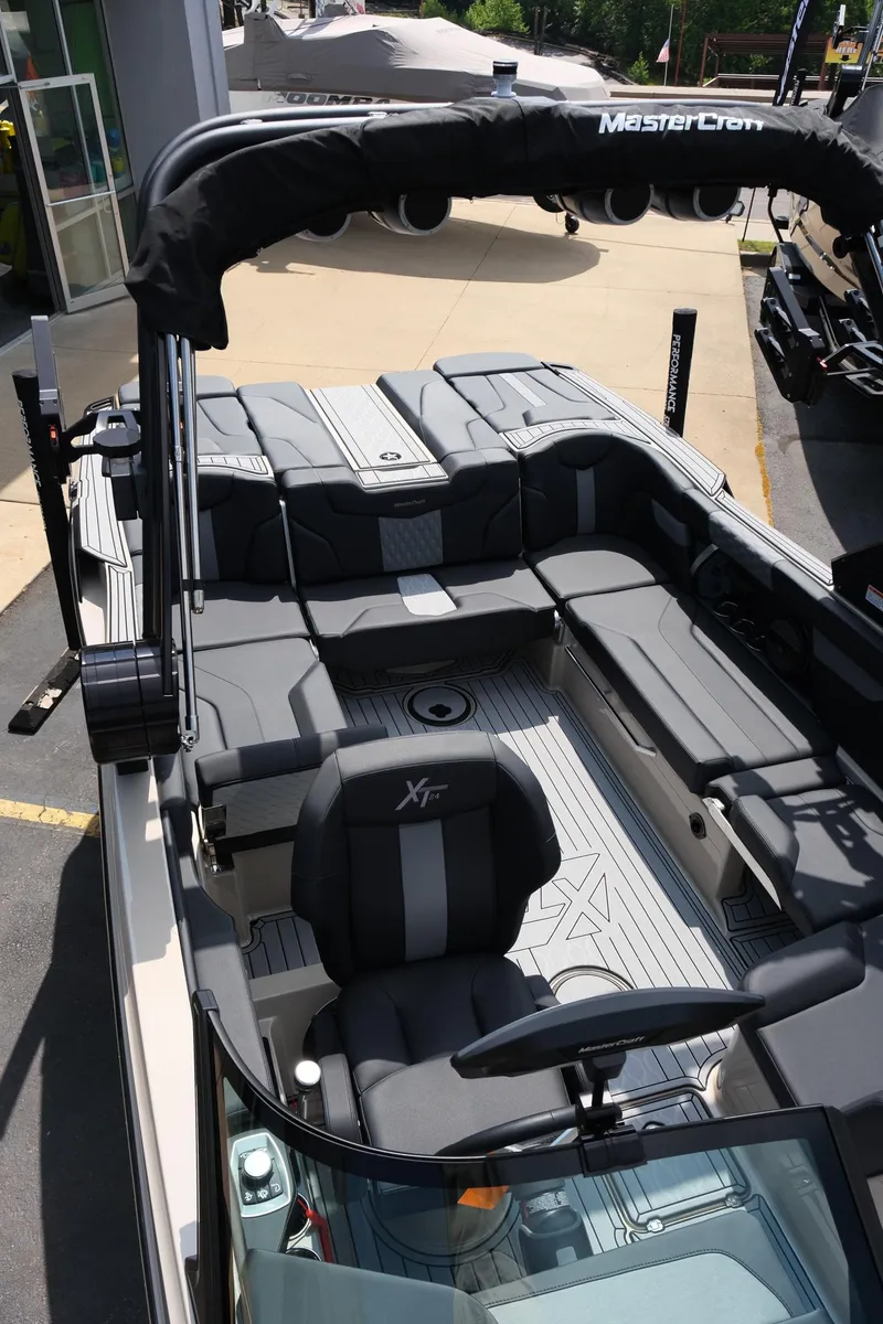Slide: The Image of 2025 MasterCraft XT24 boat interior with sleek seating and modern design. - 30