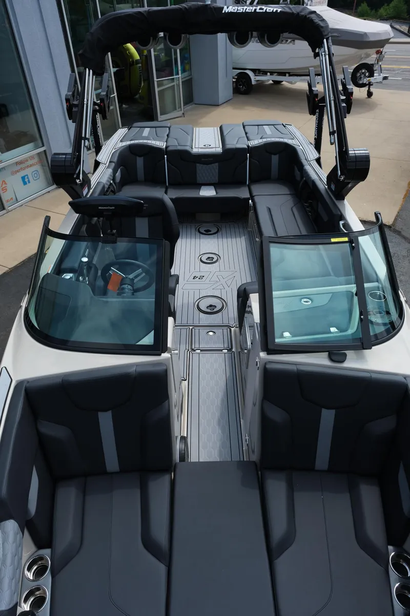 Slide: The Image of 2025 MasterCraft XT24 boat interior with sleek seating and modern design. - 32