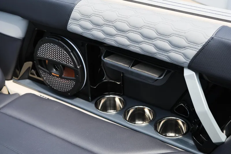 Slide: The Image of 2025 MasterCraft XT24 interior with speaker and cup holders. - 40