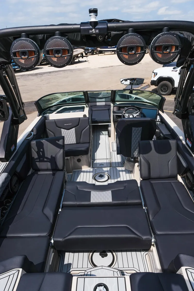 Slide: The Image of 2025 MasterCraft XT24 boat interior with premium seating and advanced audio system. - 41