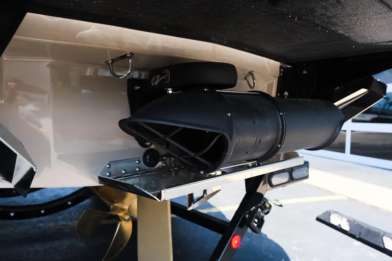 Slide: The Image of 2025 MasterCraft XT24 boat exhaust system and propeller detail. - 8
