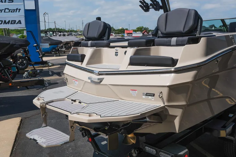 Slide: The Image of 2025 MasterCraft XT24 boat rear view with swim platform and seating. - 9