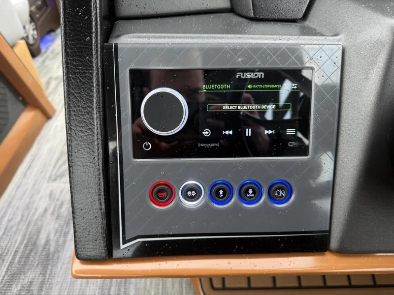 Slide: The Image of Control panel of 2025 Tahoe Pontoon Grand Tahoe LTD with Bluetooth audio system. - 13