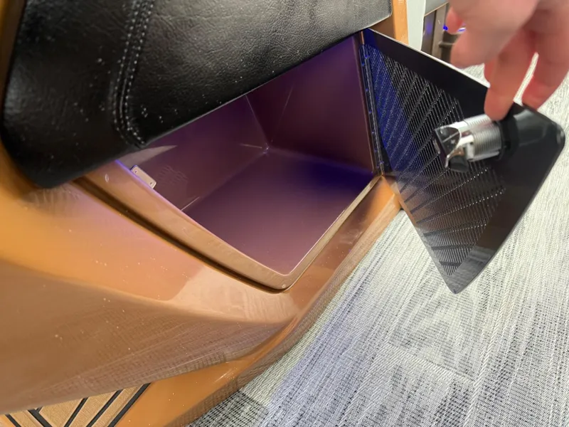 Slide: The Image of Storage compartment in 2025 Tahoe Pontoon Grand Tahoe LTD Quad Lounge Windshield boat. - 19