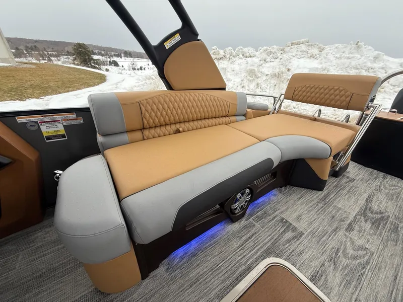 Slide: The Image of 2025 Tahoe Pontoon Grand Tahoe LTD Quad Lounge interior with plush seating and modern design. - 23