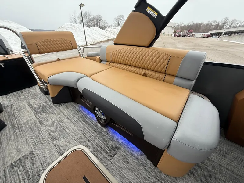Slide: The Image of 2025 Tahoe Pontoon Grand Tahoe LTD Quad Lounge interior with luxurious seating and modern design. - 24