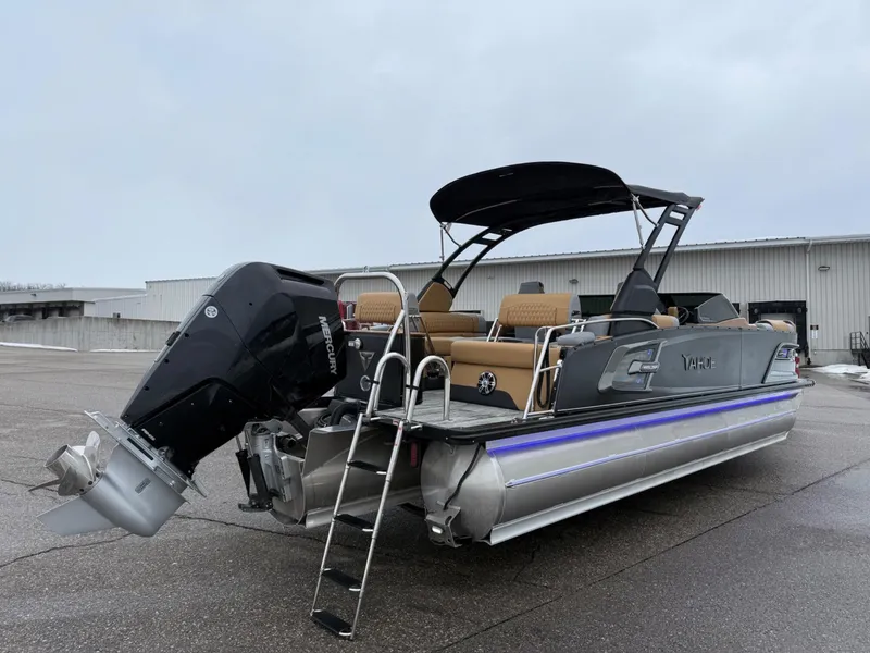 Slide: The Image of 2025 Tahoe Pontoon Grand Tahoe LTD Quad Lounge Windshield on pavement, showcasing sleek design and powerful engine. - 4