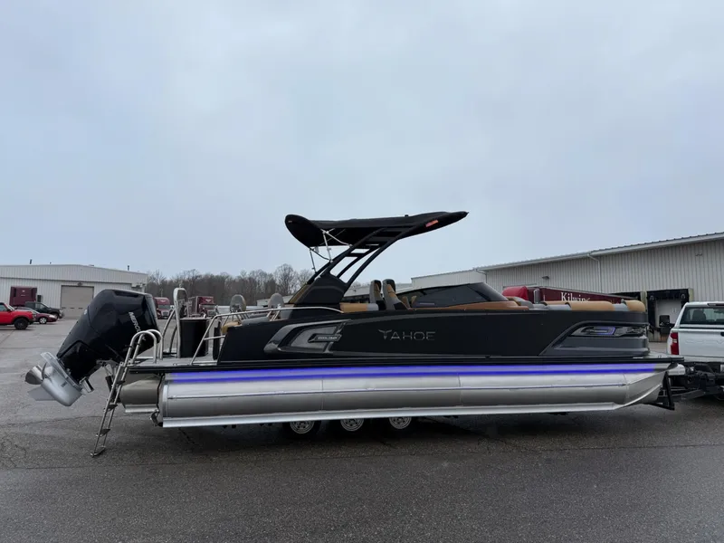 Slide: The Image of 2025 Tahoe Pontoon Grand Tahoe LTD Quad Lounge Windshield on display outdoors. - 5