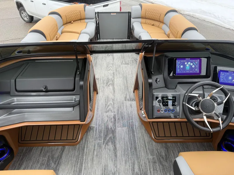 Slide: The Image of 2025 Tahoe Pontoon Grand Tahoe LTD Quad Lounge Windshield interior with modern dashboard and seating. - 8