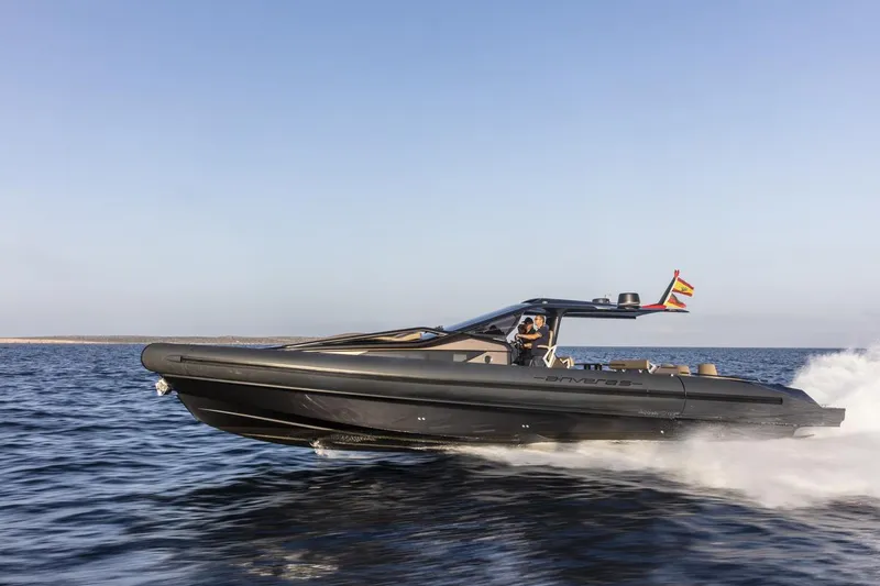 Slide: The Image of 2025 Anvera 48 speedboat cruising on open water under clear skies. - 1