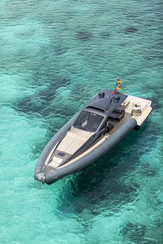 Slide: The Image of Futuristic 2025 Anvera 48 yacht on clear turquoise water, showcasing sleek design and luxury. - 12