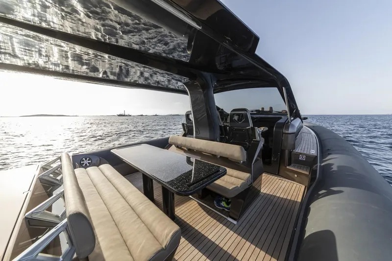 Slide: The Image of 2025 Anvera 48 luxury yacht with sleek design and spacious deck on open water. - 14