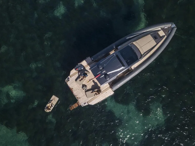 Slide: The Image of Aerial view of 2025 Anvera 48 yacht on clear water, with people on deck. - 17