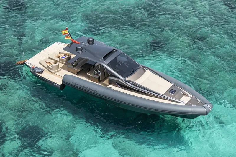 Slide: The Image of Aerial view of 2025 Anvera 48 luxury boat on clear turquoise water. - 19