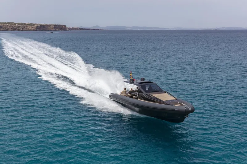 Slide: The Image of 2025 Anvera 48 yacht cruising on open sea, leaving a trail of white water. - 2