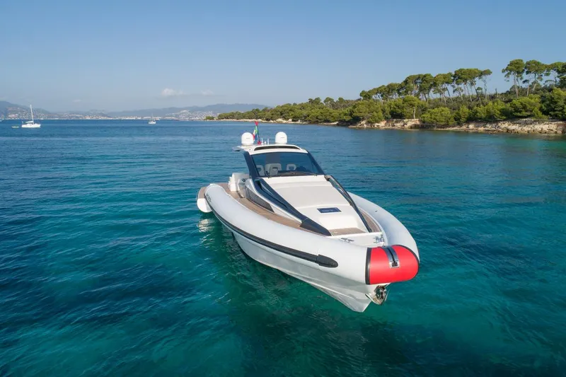 Slide: The Image of Anvera 48 luxury yacht cruising in clear blue waters, 2025 model. - 21