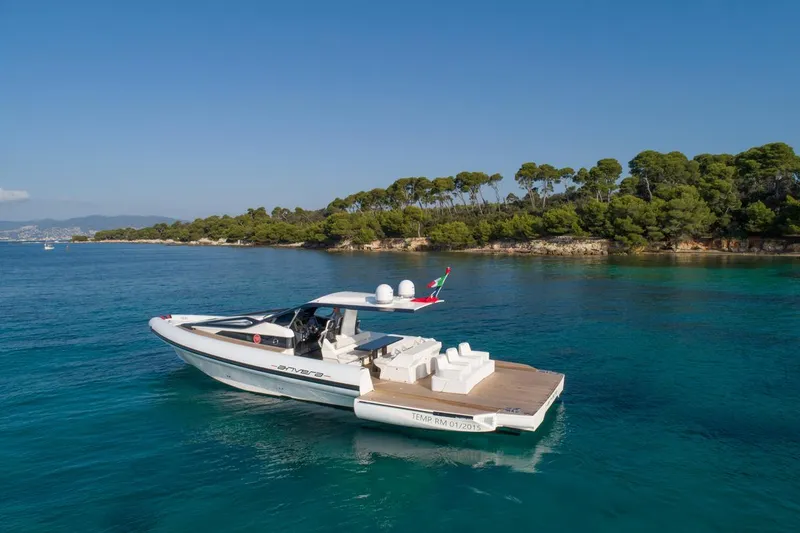 Slide: The Image of Anvera 48 luxury yacht cruising near a scenic coastline, 2025 model. - 23