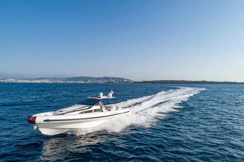 Slide: The Image of 2025 Anvera 48 yacht cruising on open sea under clear blue sky. - 24