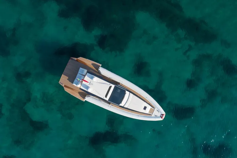 Slide: The Image of Aerial view of 2025 Anvera 48 yacht on clear turquoise water. - 25