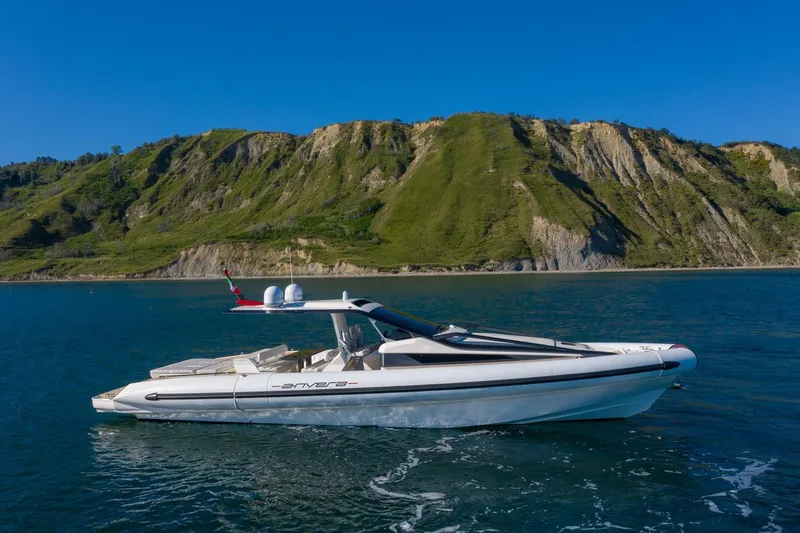Slide: The Image of 2025 Anvera 48 yacht cruising near scenic coastal cliffs. - 26