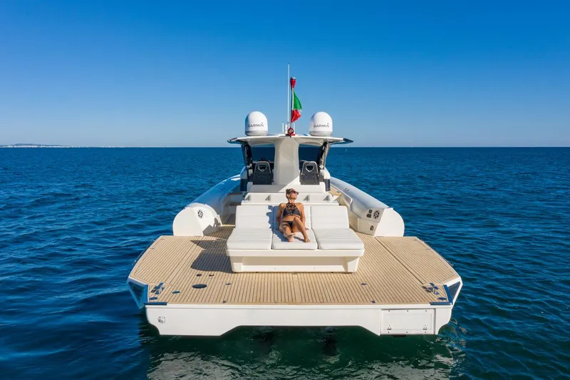 Slide: The Image of 2025 Anvera 48 yacht on open sea with person relaxing on deck. - 27