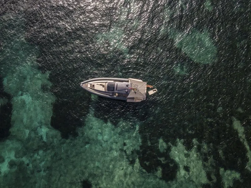 Slide: The Image of Aerial view of 2025 Anvera 48 yacht on clear turquoise water. - 29