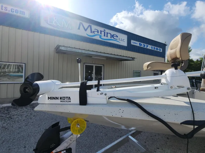 Slide: The Image of 2025 Xpress H22B boat with Minn Kota Maxxum motor at L&M Marine dealership. - 4