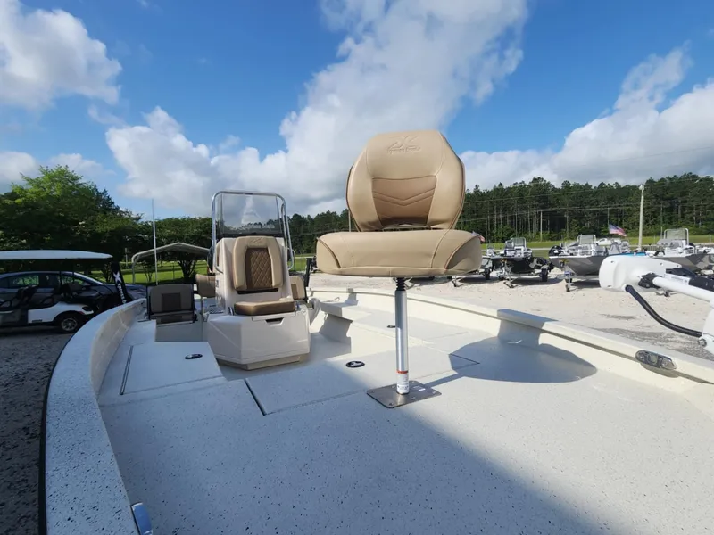Slide: The Image of 2025 Xpress H22B boat deck with seating, under a clear blue sky. - 6