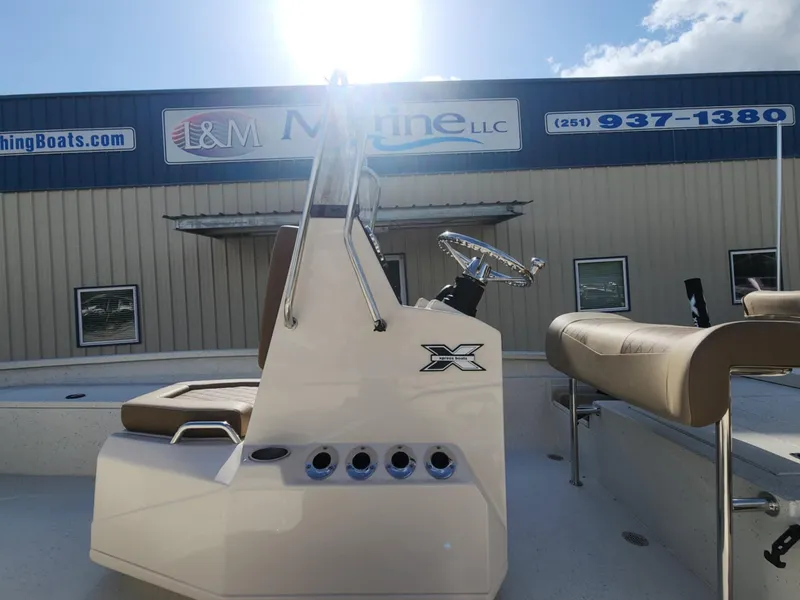 Slide: The Image of 2025 Xpress H22B boat at I&M Marine dealership, featuring sleek design and modern controls. - 7