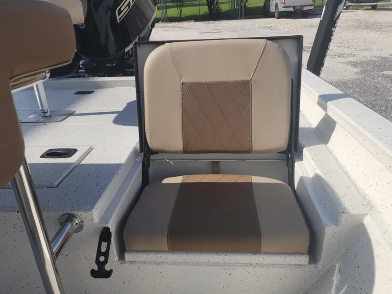 Slide: The Image of 2025 Xpress H22B boat seat with beige and brown upholstery, featuring diamond stitching. - 9