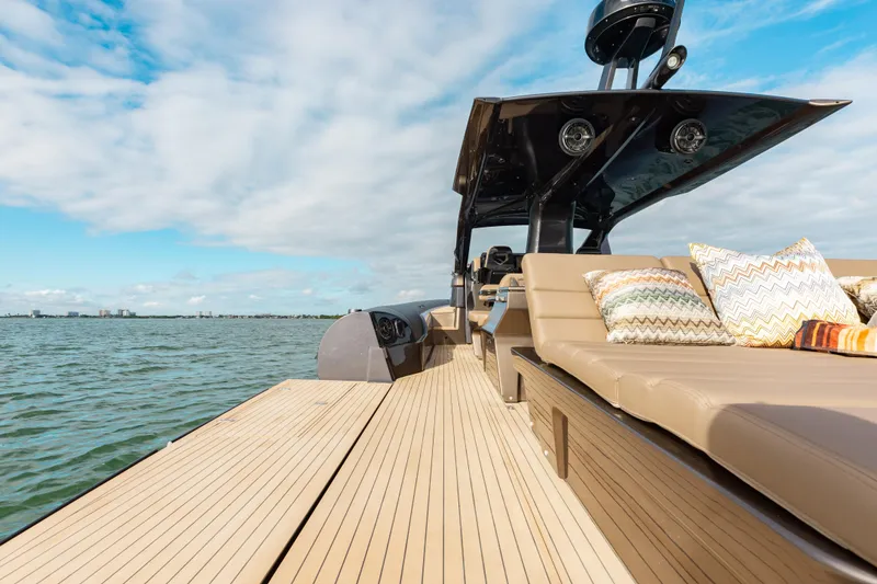 Slide: The Image of Luxurious 2025 Anvera 48 yacht with spacious deck and comfortable seating on open water. - 11