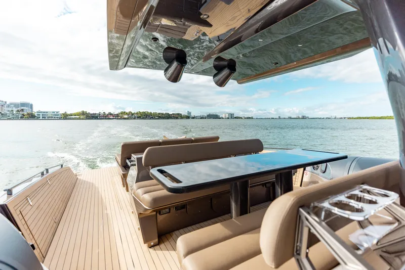 Slide: The Image of Luxury Anvera 48 yacht deck with seating and table, cruising on open water, 2025 model. - 18