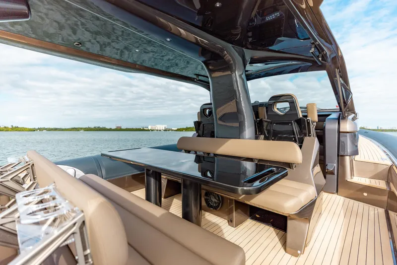 Slide: The Image of Luxurious Anvera 48 yacht interior with sleek seating and table, 2025 model. - 19