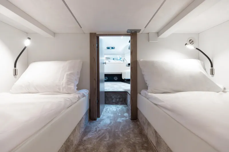 Slide: The Image of Luxurious Anvera 48 yacht cabin with twin beds, modern lighting, and elegant design, 2025 model. - 24