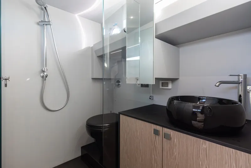 Slide: The Image of Modern bathroom in 2025 Anvera 48 yacht with sleek fixtures and elegant design. - 27