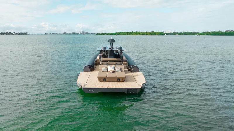 Slide: The Image of Anvera 48 luxury boat on open water, 2025 model, rear view. - 31